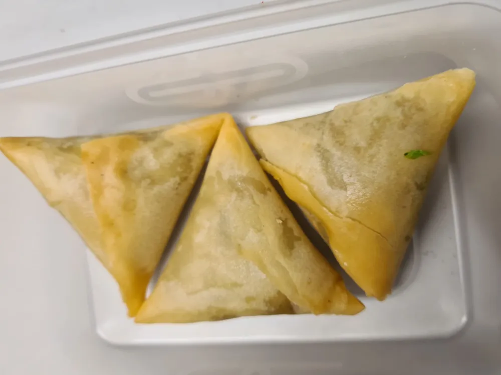Three golden samosas